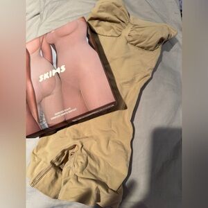 SKIMS Strapless Shortie Bodysuit in Clay